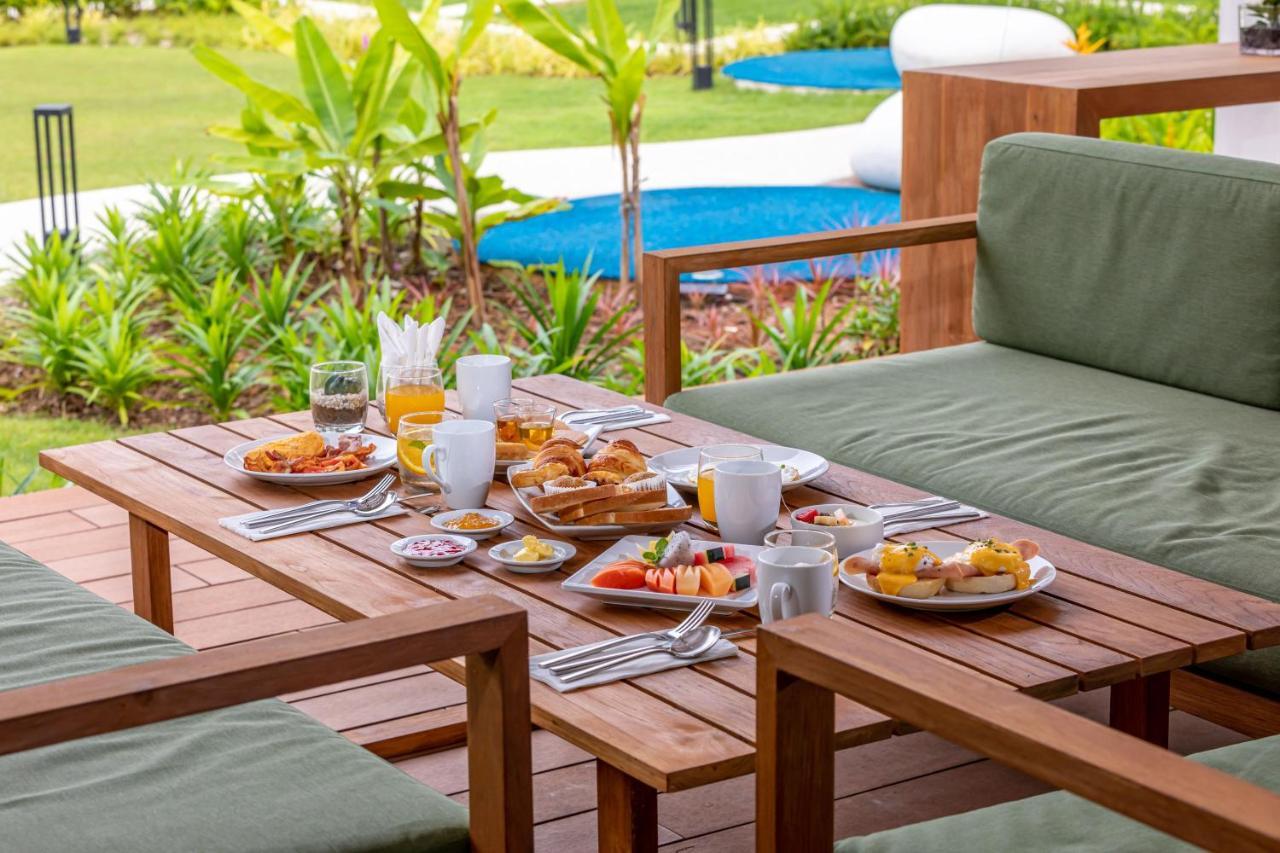 Outrigger Khao Lak Beach Resort - Sha Extra Plus Dış mekan fotoğraf A breakfast table